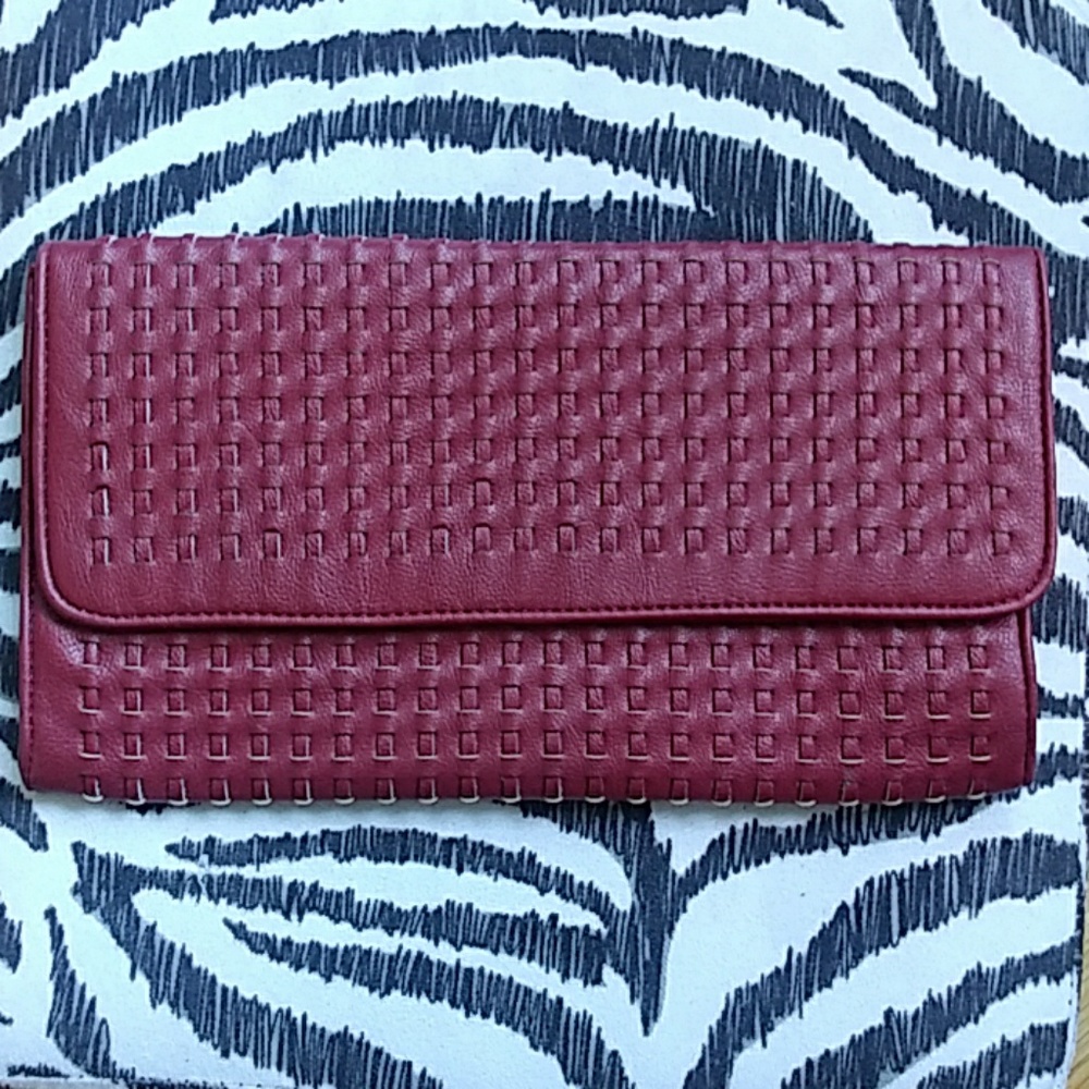 Burgundy stitched clutch